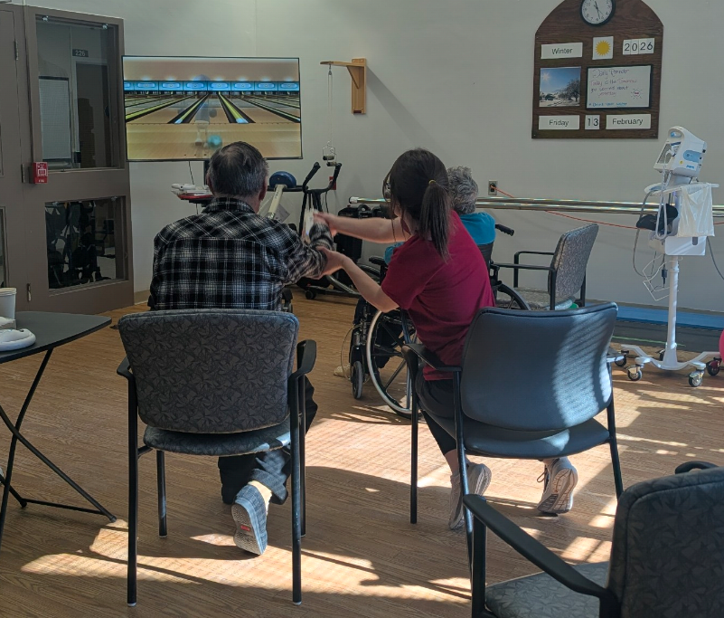 Caitlyn Payne with patients in Restorative Care